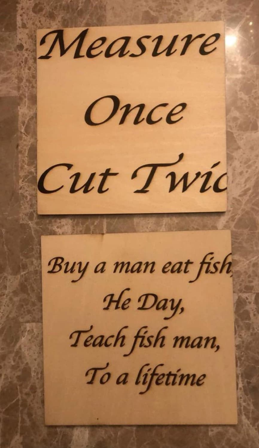 signage - Measure Once Cut Twic Buy a man eat fish He Day, Teach fish man, To a lifetime